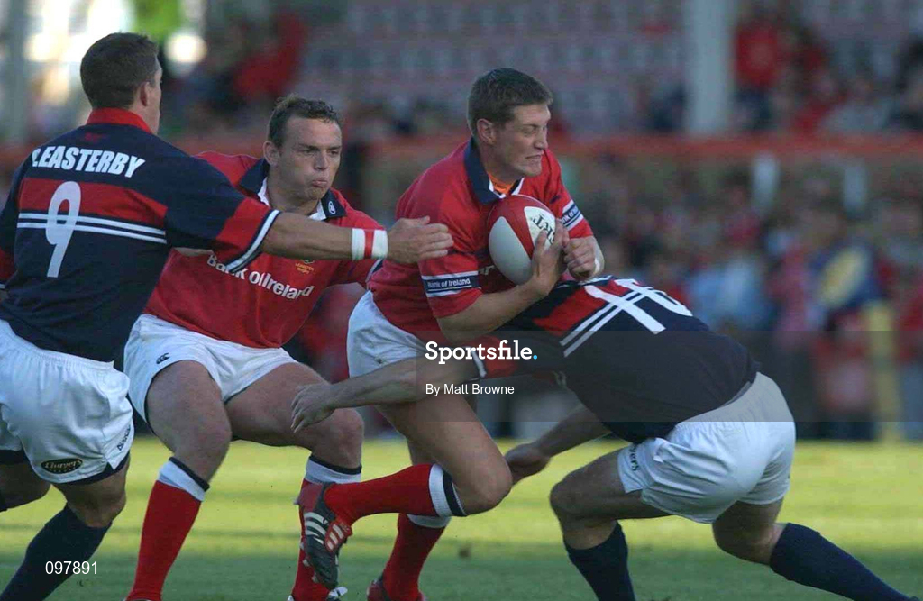 31 August 2002; Ronan O'Gara of Munster is tackled by Guy Easterby, left, and Stephen Jones of Llanelli during the Celtic League Pool A match between Llanelli and Munster at Stradey Park in Llanelli, Wales. Photo by Matt Browne/Sportsfile