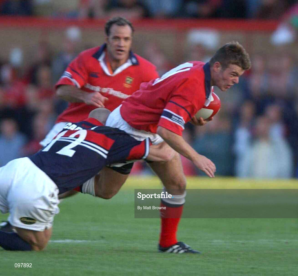 31 August 2002; Mossy Lawlor of Munster is tackled by Matt Cardey of Llanelli during the Celtic League Pool A match between Llanelli and Munster at Stradey Park in Llanelli, Wales. Photo by Matt Browne/Sportsfile