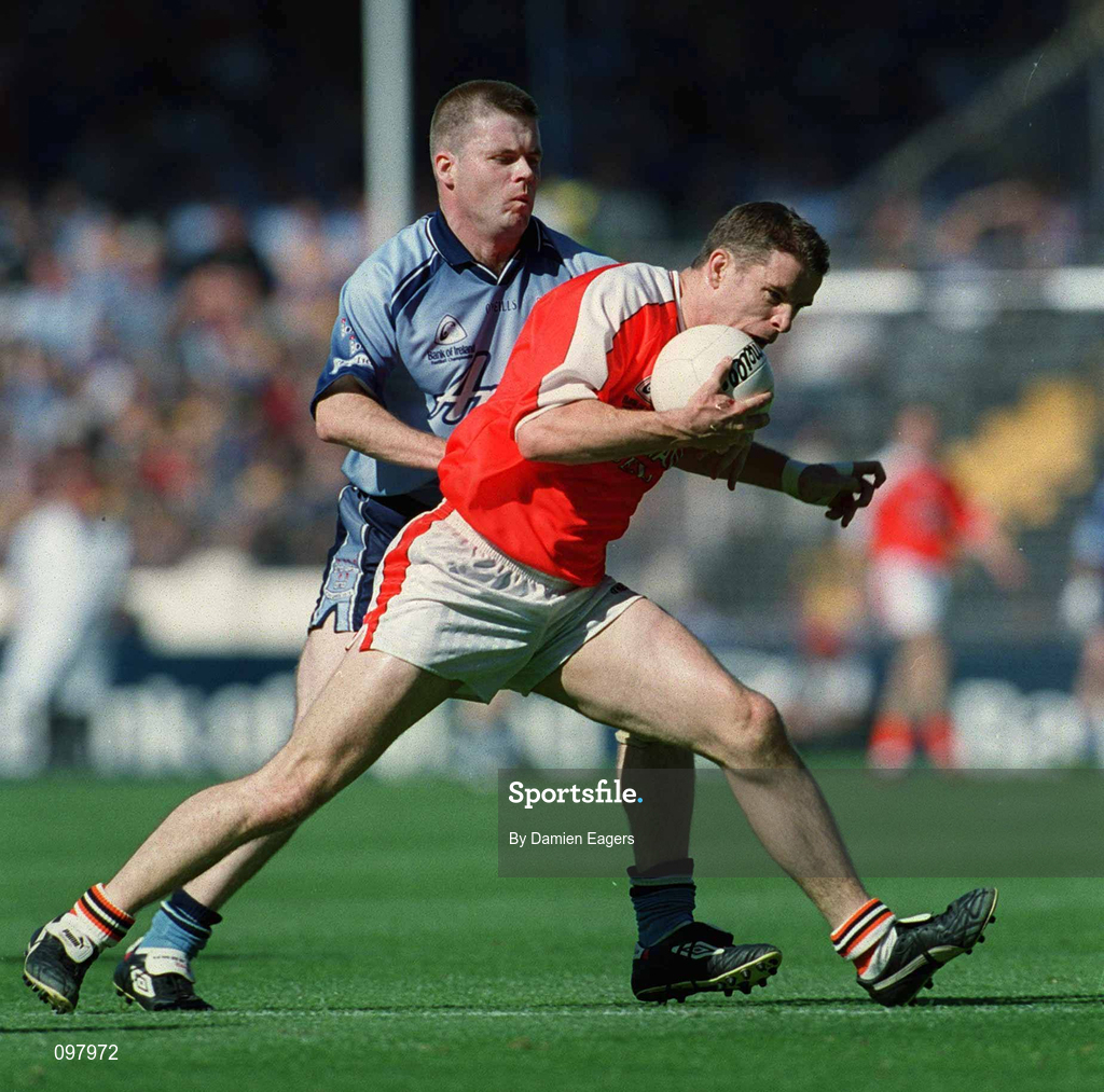 1 September 2002; Paul McGrane of Armagh is tackled by Dessie Farrell of Dublin during the Bank of Ireland All-Ireland Senior Football Championship Semi-Final match between Armagh and Dublin at Croke Park in Dublin. Photo by Damien Eagers/Sportsfile