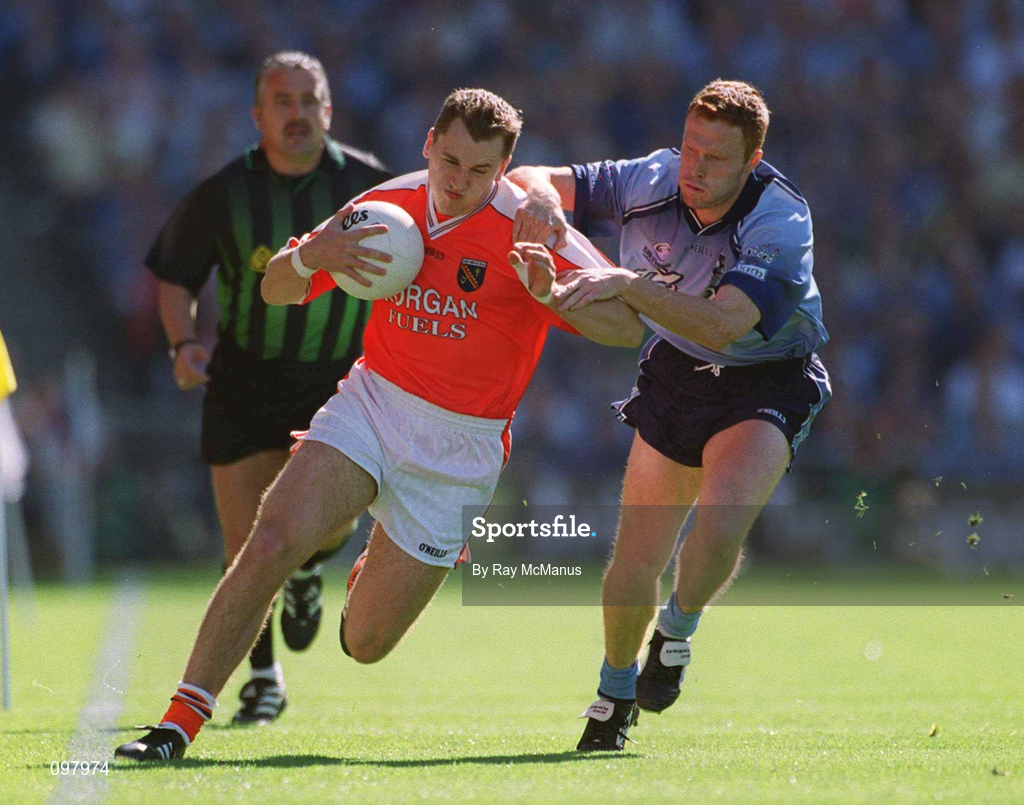 1 September 2002; Paddy McKeever of Armagh is tackled by Peadar Andrews of Dublin during the Bank of Ireland All-Ireland Senior Football Championship Semi-Final match between Armagh and Dublin at Croke Park in Dublin. Photo by Ray McManus/Sportsfile