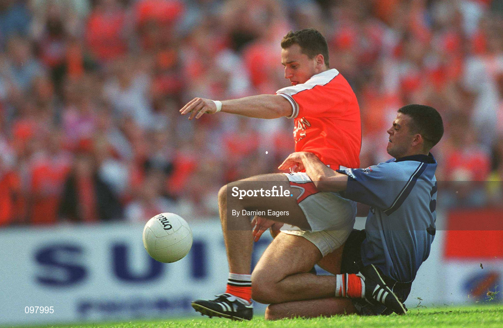 1 September 2002; Paddy McKeever of Armagh slides in to score his side's only goal despite the tackle from Paul Casey of Dublin during the Bank of Ireland All-Ireland Senior Football Championship Semi-Final match between Armagh and Dublin at Croke Park in Dublin. Photo by Damien Eagers/Sportsfile