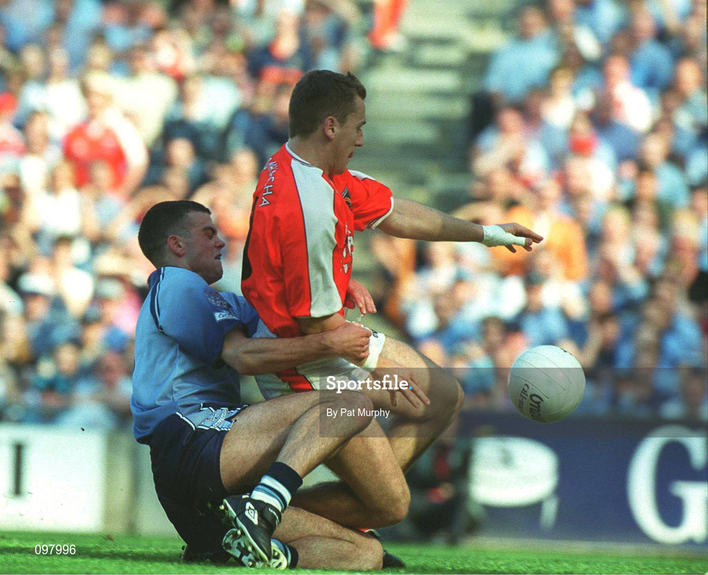 1 September 2002; Paddy McKeever of Armagh slides in ahead of Paul Casey of Dublin to score his side's first goal during the Bank of Ireland All-Ireland Senior Football Championship Semi-Final match between Armagh and Dublin at Croke Park in Dublin. Photo by Pat Murphy/Sportsfile