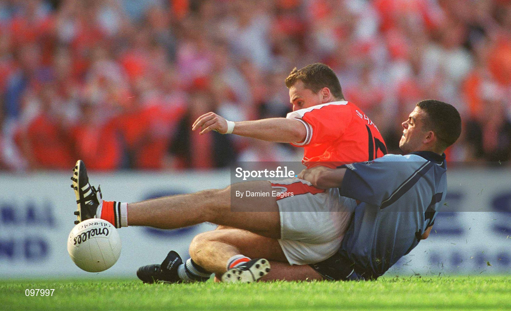 1 September 2002; Paddy McKeever of Armagh slides in to score his side's only goal despite the tackle from Paul Casey of Dublin during the Bank of Ireland All-Ireland Senior Football Championship Semi-Final match between Armagh and Dublin at Croke Park in Dublin. Photo by Damien Eagers/Sportsfile