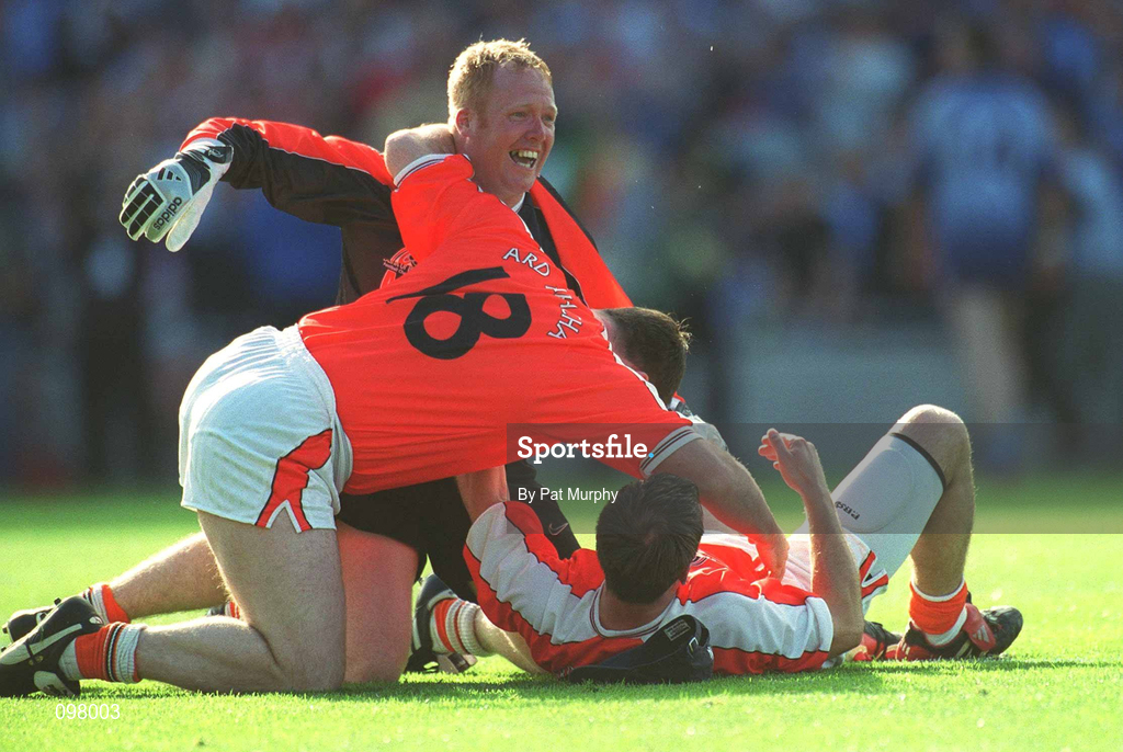 1 September 2002; Armagh players Cathal O'Rourke, 18, Brendan Tierney, centre, and Enda McNulty celebrate at the final whistle of the Bank of Ireland All-Ireland Senior Football Championship Semi-Final match between Armagh and Dublin at Croke Park in Dublin. Photo by Pat Murphy/Sportsfile