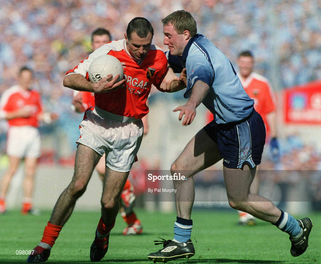 1 September 2002; Steven McDonnell of Armagh is tackled by Coman Goggins of Dublin during the Bank of Ireland All-Ireland Senior Football Championship Semi-Final match between Armagh and Dublin at Croke Park in Dublin. Photo by Pat Murphy/Sportsfile