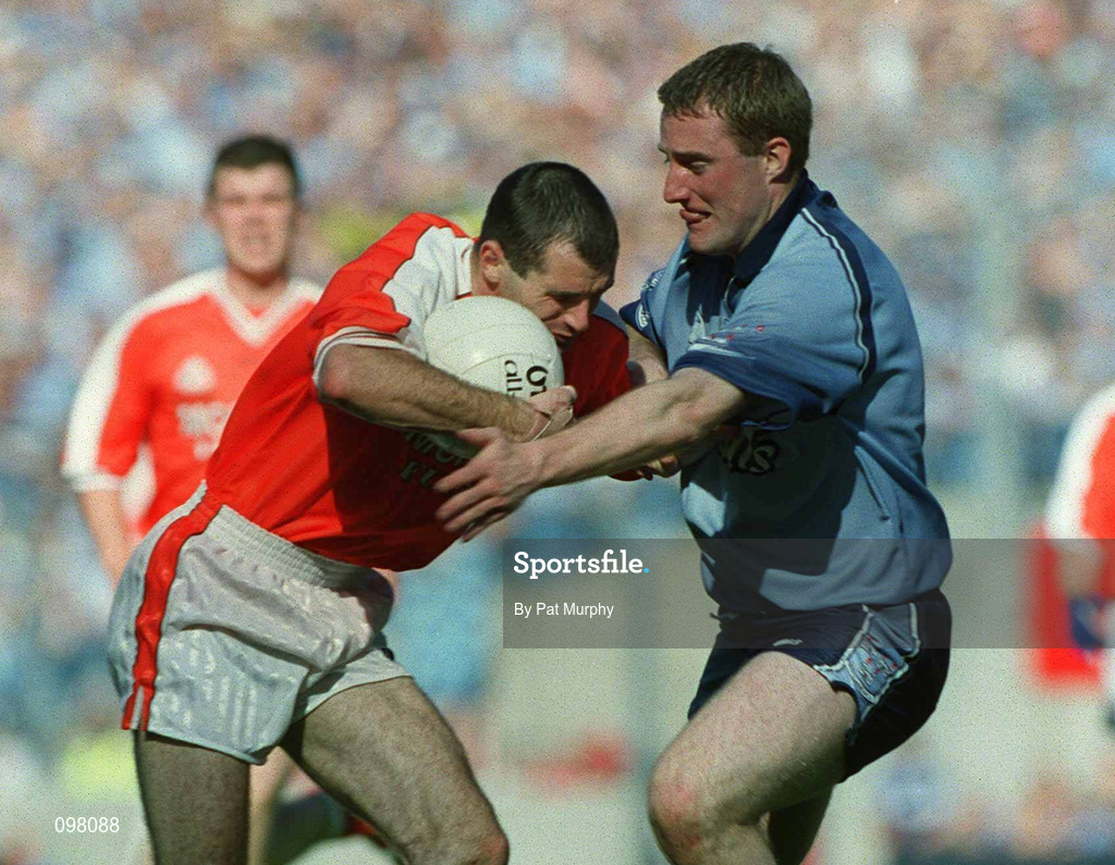 1 September 2002; Steven McDonnell of Armagh is tackled by Coman Goggins of Dublin during the Bank of Ireland All-Ireland Senior Football Championship Semi-Final match between Armagh and Dublin at Croke Park in Dublin. Photo by Pat Murphy/Sportsfile