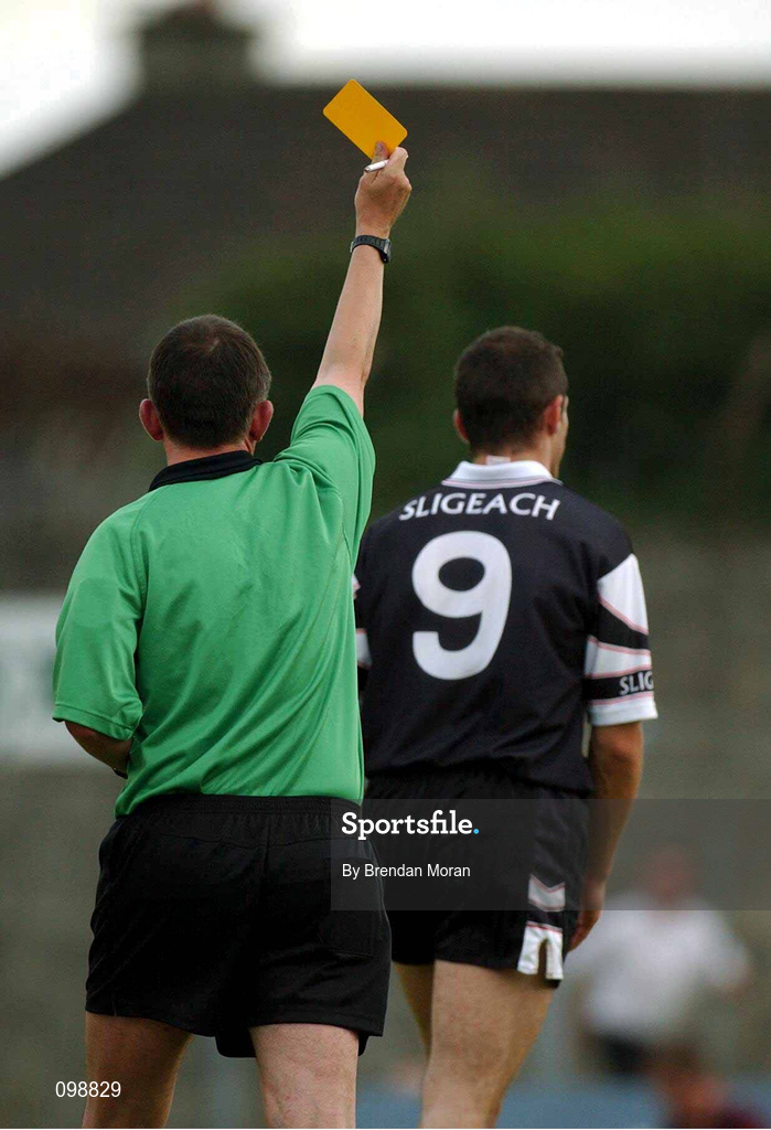 18 August 2002; Eamonn O'Hara of Sligo is shown a yellow card by referee Seamus McCormack during the Bank of Ireland All-Ireland Senior Football Championship Quarter-Final Replay match between Armagh and Sligo at Páirc Táilteann in Navan, Meath. Photo by Brendan Moran/Sportsfile