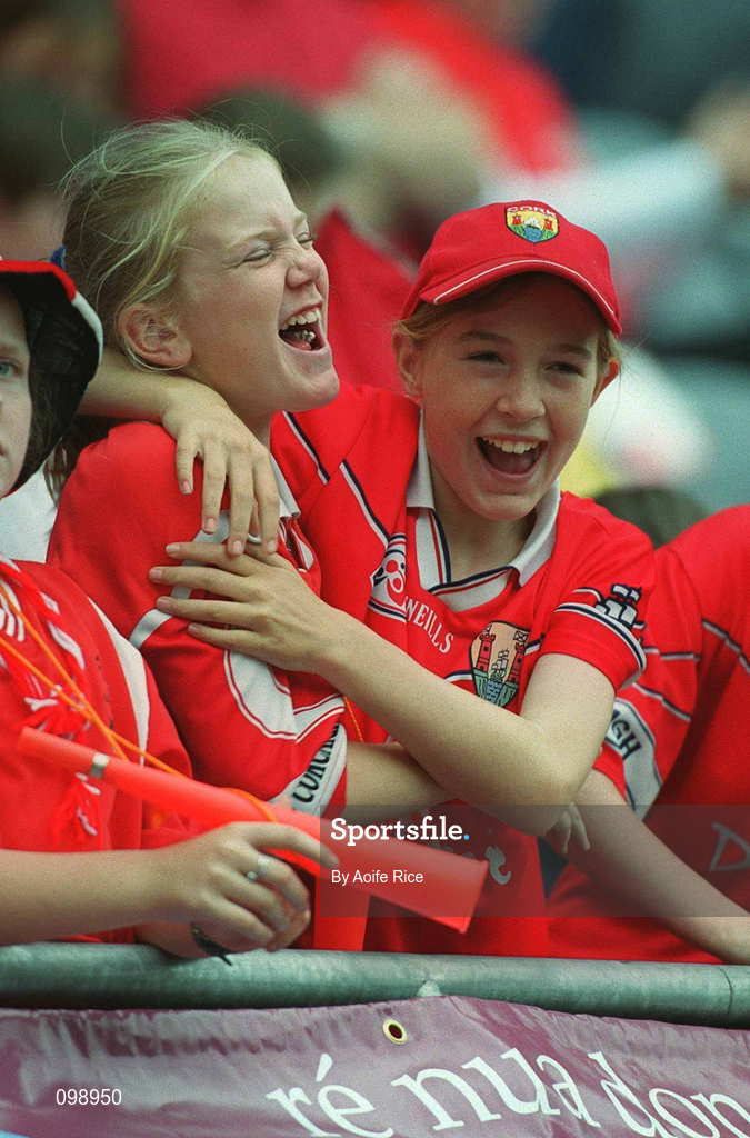 15 September 2002; Cork supporters Kate O'Donoghue, left, and Sarah Buckley, both from Ballincollig, Cork, celebrate their side's victory in the All-Ireland Senior Camogie Championship Final match between Cork and Tipperary at Croke Park in Dublin. Photo by Aoife Rice/Sportsfile