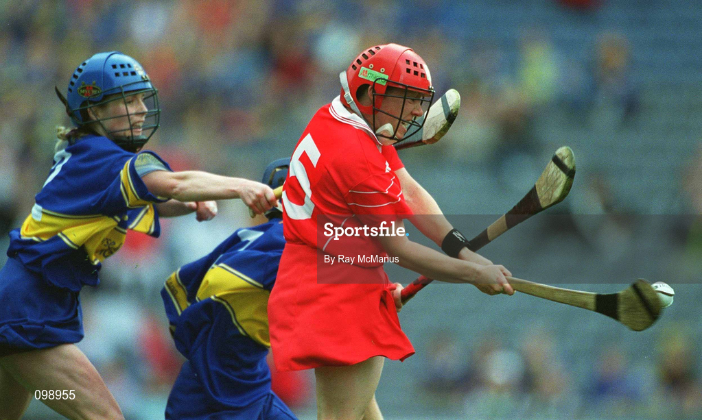 15 September 2002; Fiona O'Driscoll of Cork shoots to score her sides fourth goal, despite the attentions of Paula Bulfin, left, and Una O'Dwyer of Tipperary during the All-Ireland Senior Camogie Championship Final match between Cork and Tipperary at Croke Park in Dublin. Photo by Ray McManus/Sportsfile