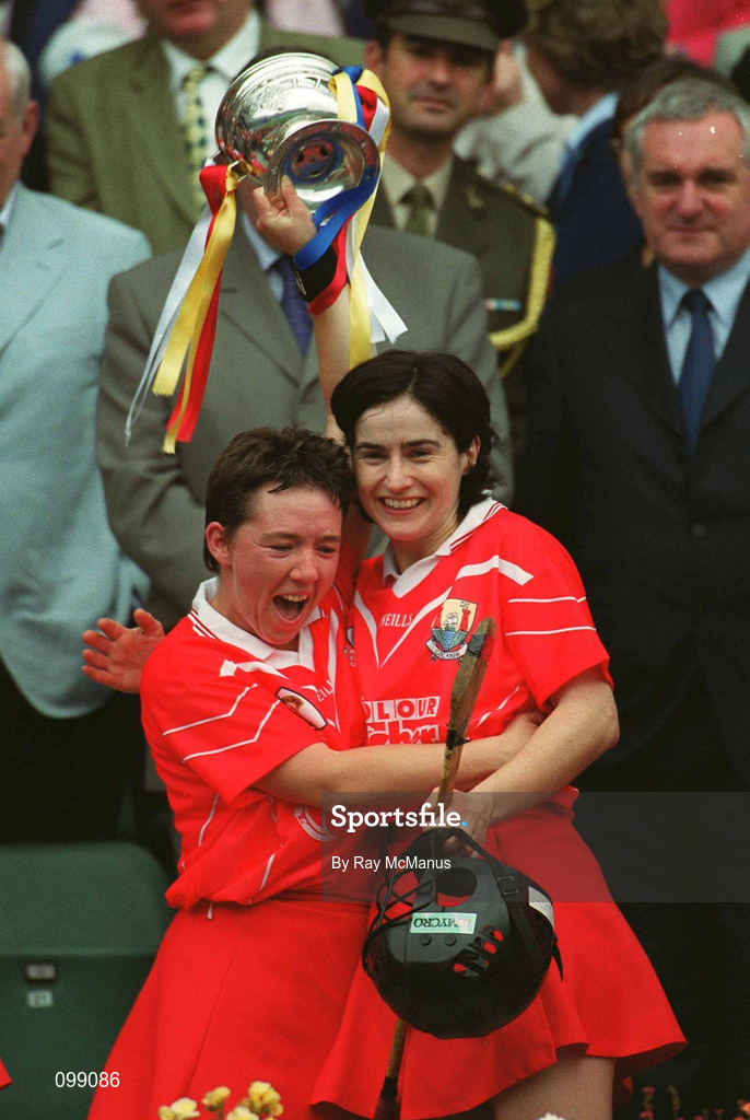 15 September 2002; Cork's Hat-trick hero, Fiona O'Driscoll, left, lifts the cup with team-mate Eithne Duggan following the All-Ireland Senior Camogie Championship Final match between Cork and Tipperary at Croke Park in Dublin. Photo by Ray McManus/Sportsfile