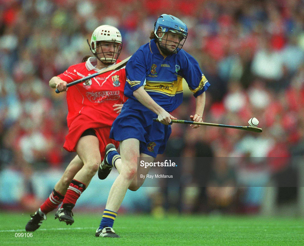 15 September 2002; Claire Grogan of Tipperary is tackled by Joanne O'Callaghan of Cork during the All-Ireland Senior Camogie Championship Final match between Cork and Tipperary at Croke Park in Dublin. Photo by Ray McManus/Sportsfile