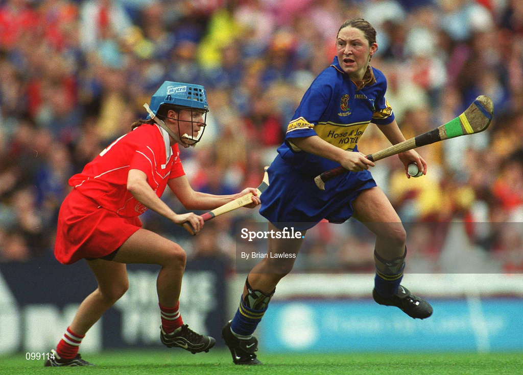 15 September 2002; Angie McDermott of Tipperary in action against Mary O'Connor of Cork during the All-Ireland Senior Camogie Championship Final match between Cork and Tipperary at Croke Park in Dublin. Photo by Brian Lawless/Sportsfile