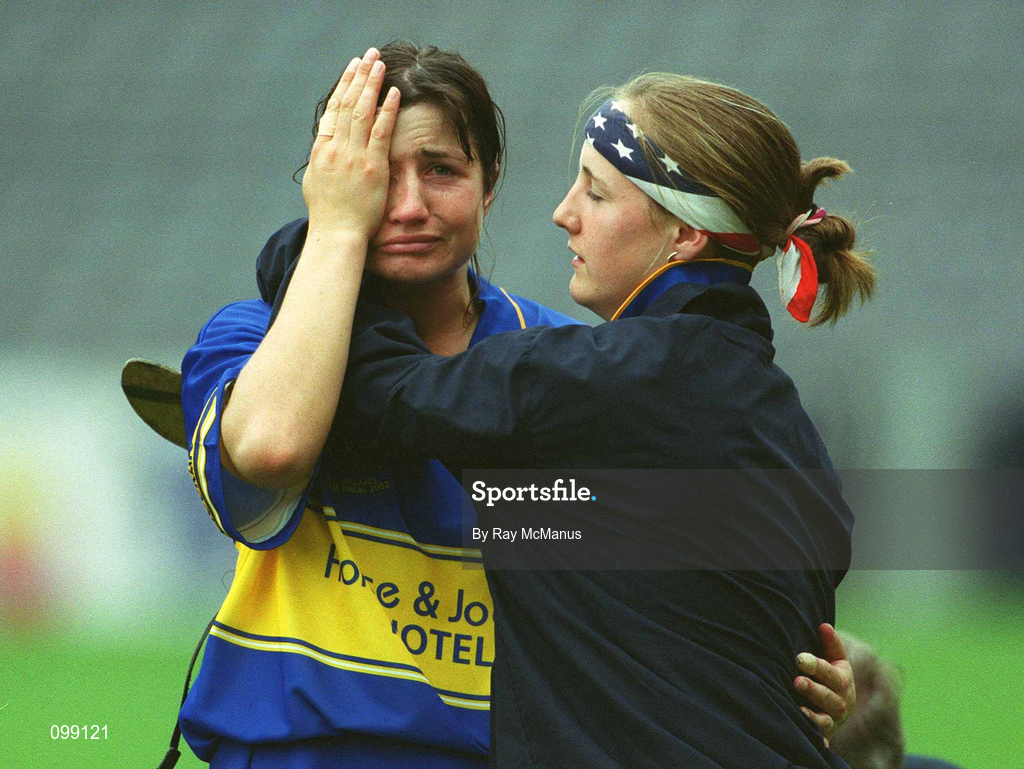 15 September 2002; Ciara Gaynor of Tipperary is consoled by a team-mate following her side's defeat in the All-Ireland Senior Camogie Championship Final match between Cork and Tipperary at Croke Park in Dublin. Photo by Ray McManus/Sportsfile