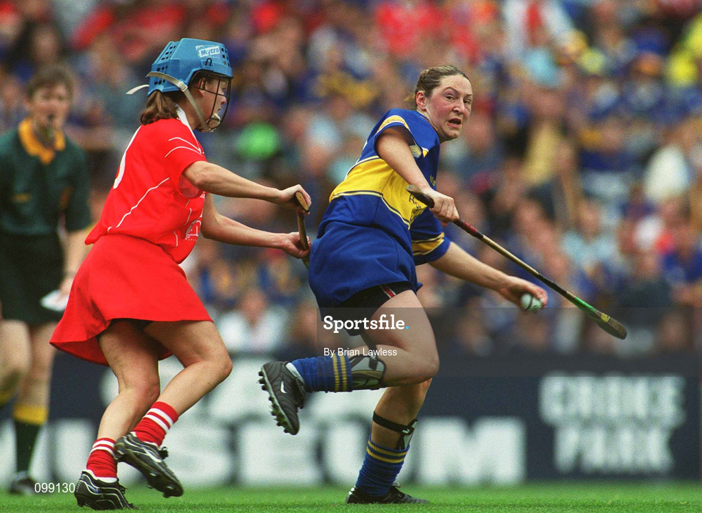 15 September 2002; Angie McDermott of Tipperary in action against Vivienne Harris of Cork during the All-Ireland Senior Camogie Championship Final match between Cork and Tipperary at Croke Park in Dublin. Photo by Brian Lawless/Sportsfile