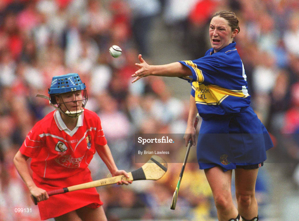 15 September 2002; Angie McDermott of Tipperary in action against Vivienne Harris of Cork during the All-Ireland Senior Camogie Championship Final match between Cork and Tipperary at Croke Park in Dublin. Photo by Brian Lawless/Sportsfile