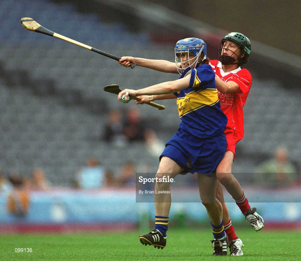 15 September 2002; Deirdre Hughes of Tipperary in action against Gemma O'Connor of Cork during the All-Ireland Senior Camogie Championship Final match between Cork and Tipperary at Croke Park in Dublin. Photo by Brian Lawless/Sportsfile