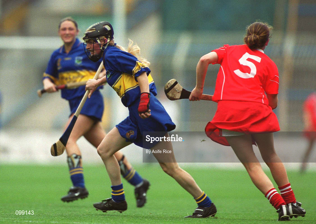 15 September 2002; Joanne Ryan of Tipperary in action against Paula O'Connor of Cork during the All-Ireland Senior Camogie Championship Final match between Cork and Tipperary at Croke Park in Dublin. Photo by Aoife Rice/Sportsfile