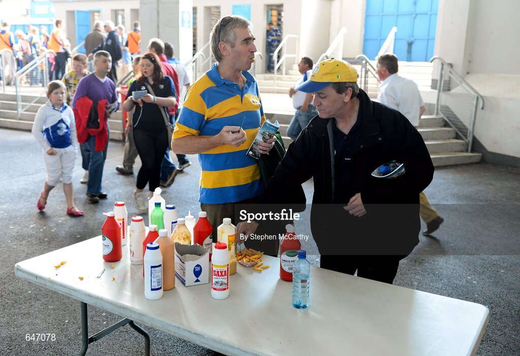 17 June 2012; Peader Derrane, left, and Johnny Murphy, from Ennis, Co. Clare, enjoy a bite to eat ahead of the game. Munster GAA Hurling Senior Championship Semi-Final, Clare v Waterford, Semple Stadium, Thurles, Co. Tipperary. Picture credit: Stephen McCarthy / SPORTSFILE