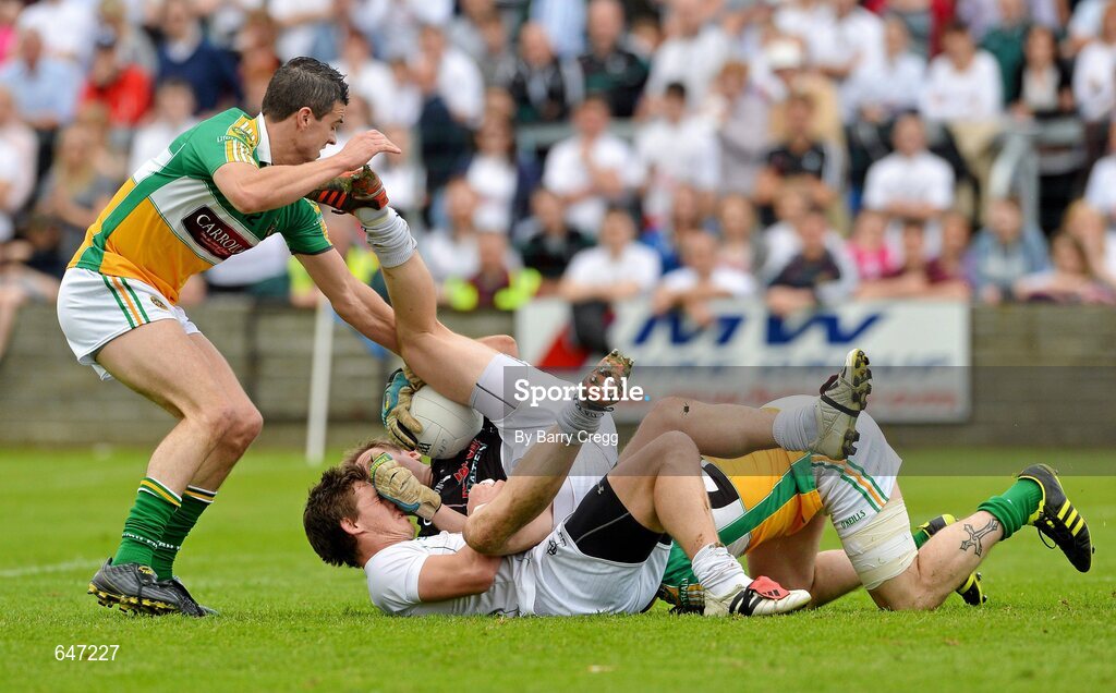 17 June 2012; Kildare goalkeeper Shane Connolly collides with team-mate Emmet Bolton, as he gathers the ball ahead of Niall Smith, left, and Derek Kelly, right, Offaly. Leinster GAA Football Senior Championship Quarter-Final, Offaly v Kildare, O'Moore Park, Portlaoise, Co. Laois. Picture credit: Barry Cregg / SPORTSFILE