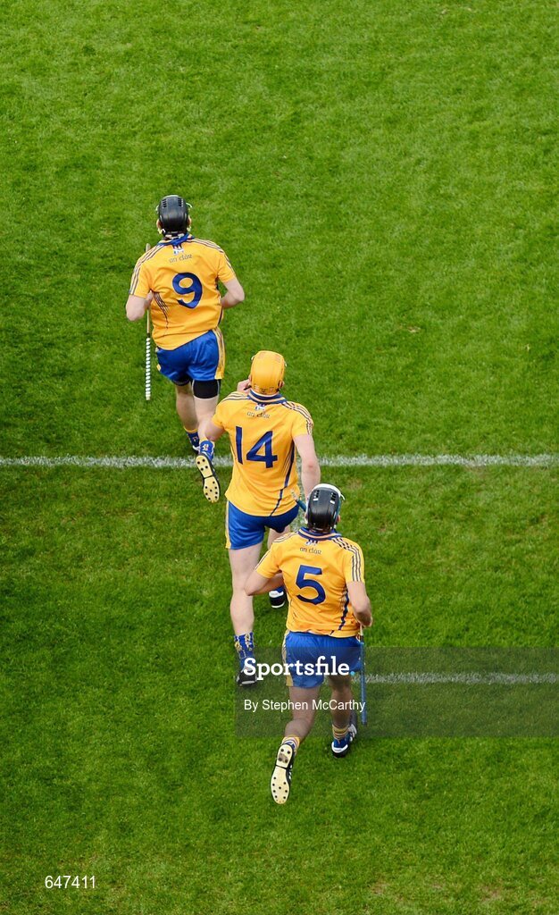 17 June 2012; Clare players Patrick Donnelllan, 9, John Conlon, 14, and Brendan Bolger, 5, make their way onto the pitch ahead of the game. Munster GAA Hurling Senior Championship Semi-Final, Clare v Waterford, Semple Stadium, Thurles, Co. Tipperary. Picture credit: Stephen McCarthy / SPORTSFILE