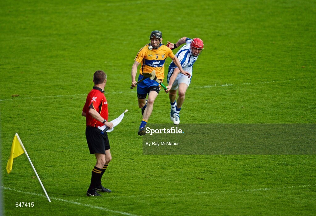 17 June 2012; Linesman Barry Kelly keeps a close eye as Patrick Donnellan, Clare, races clear of Waterford's Eoin Kelly. Munster GAA Hurling Senior Championship Semi-Final, Clare v Waterford, Semple Stadium, Thurles, Co. Tipperary. Picture credit: Ray McManus / SPORTSFILE