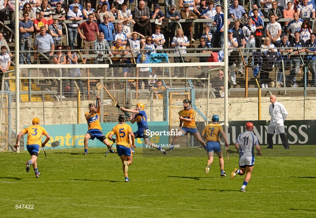 17 June 2012; Eoin Kelly's shot, from the penalty spot, flashes past Clare players, Patrick Donnellan, left, goalkeeper Patrick Kelly and Nicky O'Connell, for the first Waterford goal. Munster GAA Hurling Senior Championship Semi-Final, Clare v Waterford, Semple Stadium, Thurles, Co. Tipperary. Picture credit: Ray McManus / SPORTSFILE