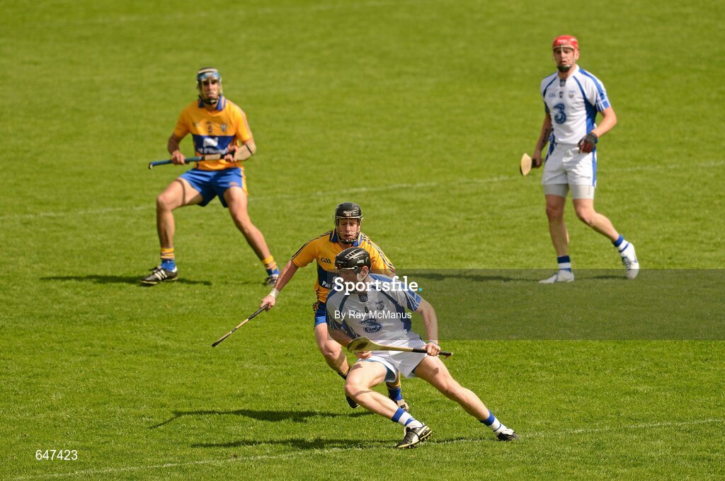 17 June 2012; Kevin Moran, Waterford, prepares to clear under pressure from Jonathan Clancy, Clare. Munster GAA Hurling Senior Championship Semi-Final, Clare v Waterford, Semple Stadium, Thurles, Co. Tipperary. Picture credit: Ray McManus / SPORTSFILE