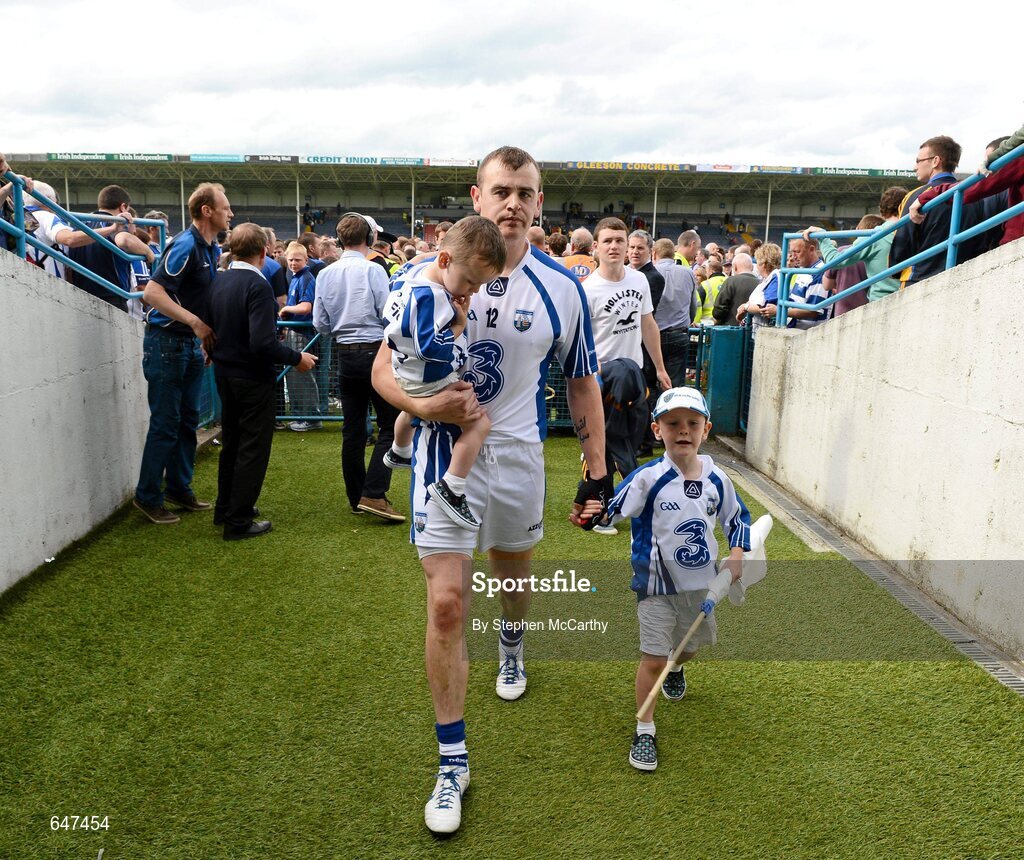 17 June 2012; Eoin Kelly, Waterford, leaves the pitch with his sons Fionn and Sean after the match. Munster GAA Hurling Senior Championship Semi-Final, Clare v Waterford, Semple Stadium, Thurles, Co. Tipperary. Picture credit: Stephen McCarthy / SPORTSFILE