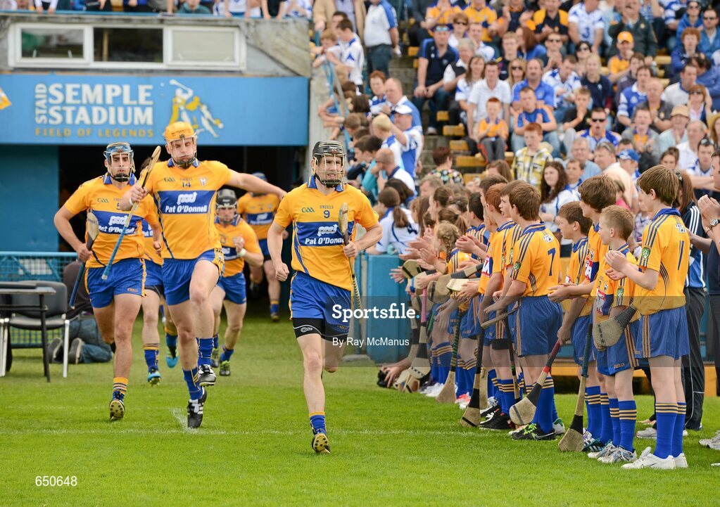 17 June 2012; Clare captain Patrick Donnellan leads his team-mates out for the game. Munster GAA Hurling Senior Championship Semi-Final, Clare v Waterford, Semple Stadium, Thurles, Co. Tipperary. Picture credit: Ray McManus / SPORTSFILE