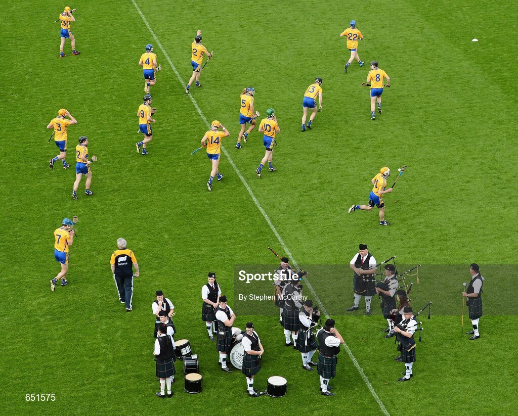 17 June 2012; The Clare team warm-up alongside the Sean Treacy Pipe band. Munster GAA Hurling Senior Championship Semi-Final, Clare v Waterford, Semple Stadium, Thurles, Co. Tipperary. Picture credit: Stephen McCarthy / SPORTSFILE