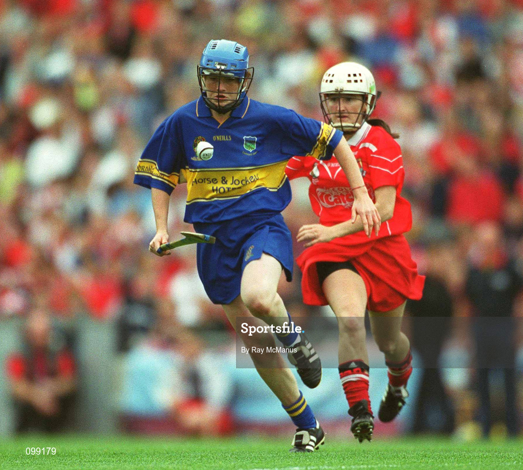 15 September 2002; Claire Grogan of Tipperary in action against Joanne O'Callaghan of Cork during the All-Ireland Senior Camogie Championship Final match between Cork and Tipperary at Croke Park in Dublin. Photo by Ray McManus/Sportsfile