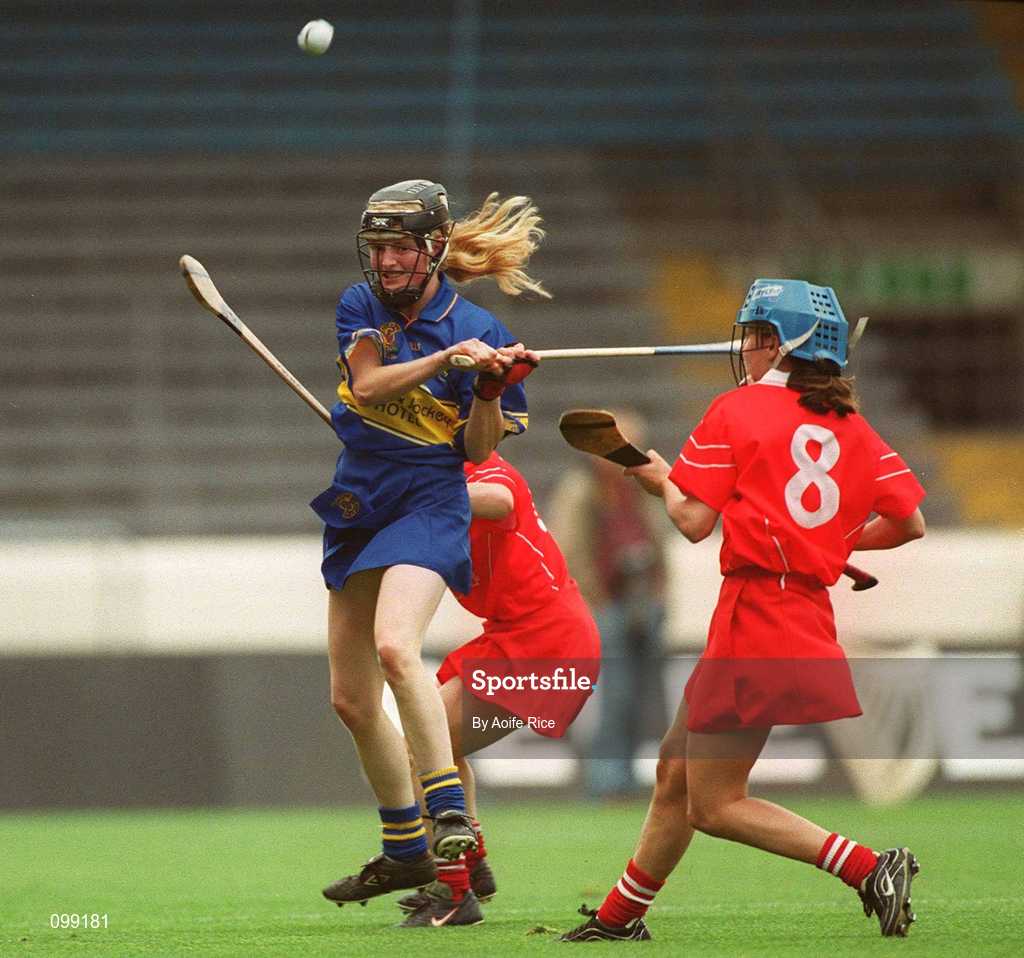 15 September 2002; Joanne Ryan of Tipperary in action against Vivienne Harris, 8, and Fiona O'Driscoll of Cork during the All-Ireland Senior Camogie Championship Final match between Cork and Tipperary at Croke Park in Dublin. Photo by Aoife Rice/Sportsfile
