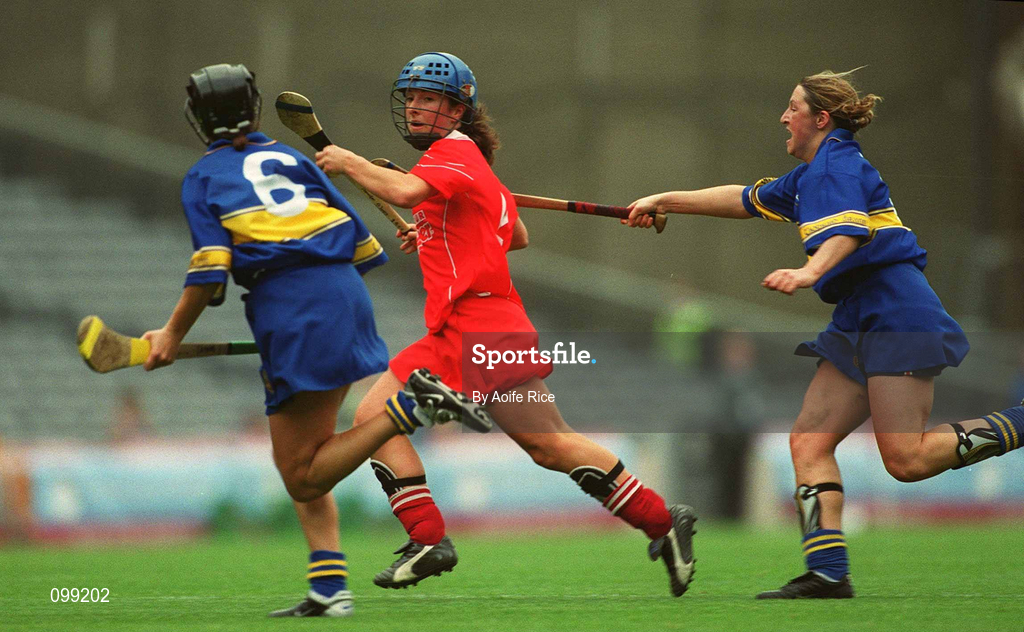 15 September 2002; Jennifer O'Leary of Cork in action against Ciara Gaynor, left, and Angie McDermott of Tipperary during the All-Ireland Senior Camogie Championship Final match between Cork and Tipperary at Croke Park in Dublin. Photo by Aoife Rice/Sportsfile