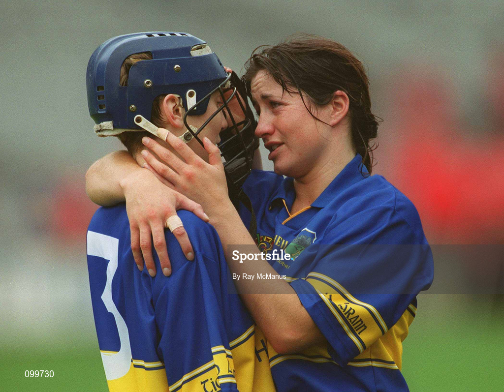 15 September 2002; Tipperary's Una O'Dwyer is consoled by team-mate Ciara Gaynor after defeat in the All-Ireland Senior Camogie Championship Final match between Cork and Tipperary at Croke Park in Dublin. Photo by Ray McManus/Sportsfile