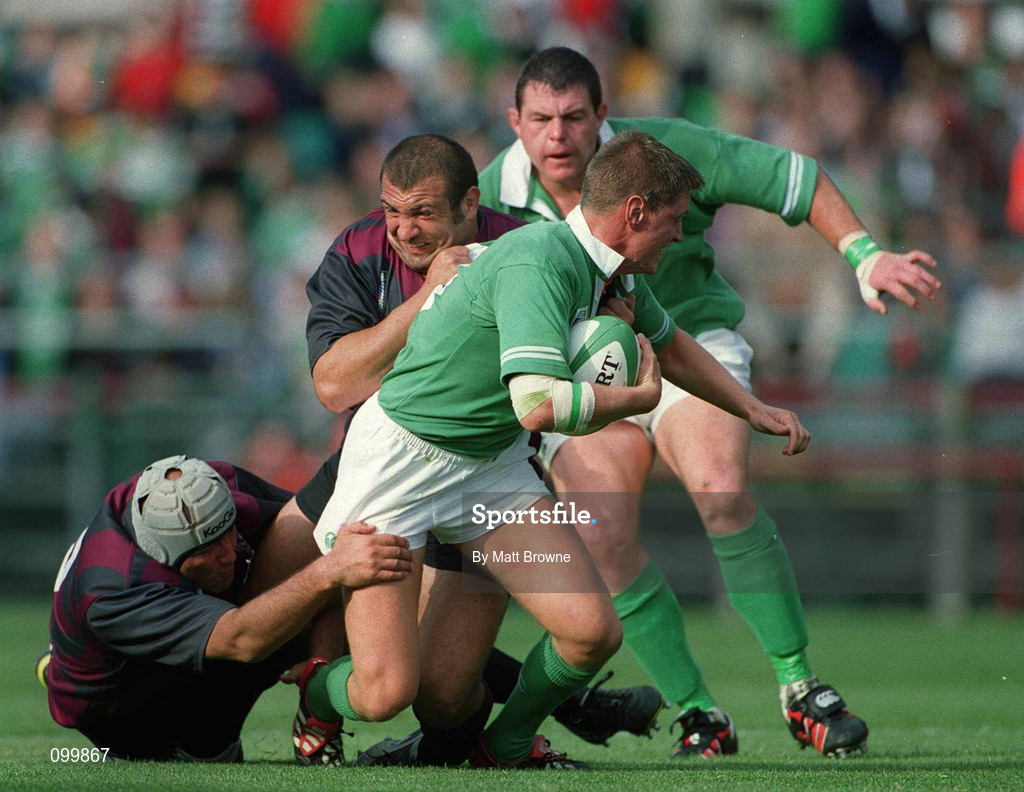 28 September 2002; Ronan O'Gara of Ireland is tackled by Victor Didebulidze, left, and Goderdzi Shvelidze of Georgia during the Rugby World Cup 2003 Qualifier match between Ireland and Georgia at Lansdowne Road in Dublin. Photo by Matt Browne/Sportsfile