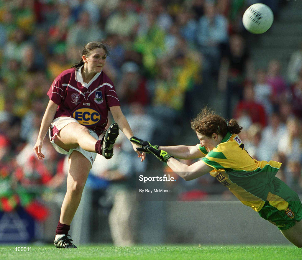 29 September 2002; Lorna Joyce of Galway gets her shot off despite the efforts of Lorraine O'Sullivan of Donegal during the All-Ireland Ladies Junior Football Championship Final match between Galway and Donegal at Croke Park in Dublin. Photo by Ray McManus/Sportsfile