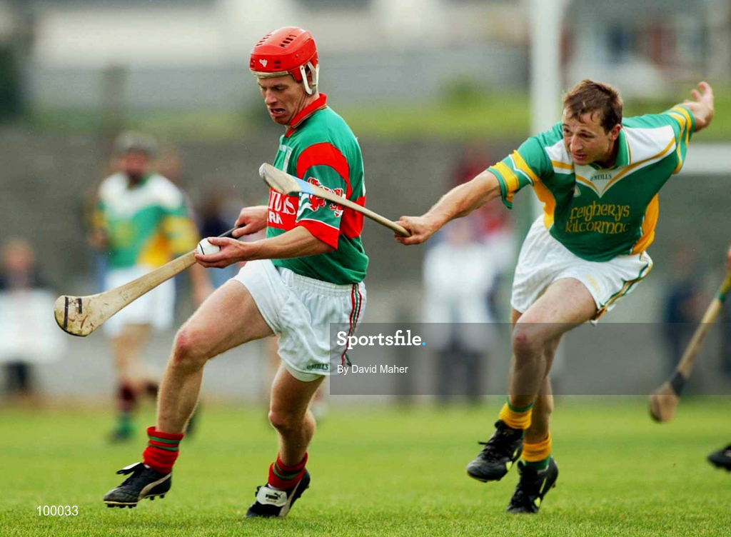29 September 2002; Paul Molloy of Birr in action against Henry Kilmartin of Kilcormac / Killoughey during the Offaly County Senior Hurling Final match between Birr and Kilcormac / Kelloughey at St. Brendan's Park in Birr, Offaly. Photo by David Maher/Sportsfile