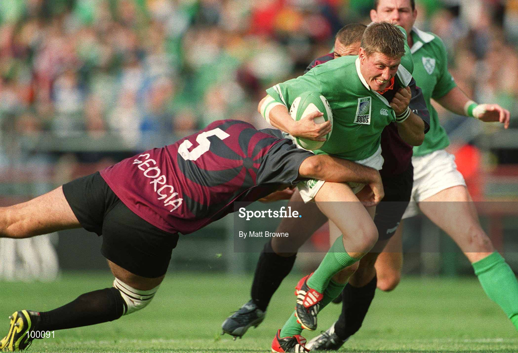 28 September 2002; Ronan O'Gara of Ireland is tackled by Victor Didebulidze, 5, and Goderdzi Shvelidze of Georgia during the Rugby World Cup 2003 Qualifier match between Ireland and Georgia at Lansdowne Road in Dublin. Photo by Matt Browne/Sportsfile
