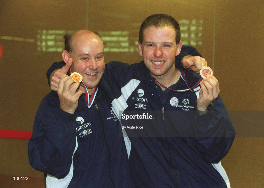 30 September 2002; Ireland's Special Olympics Basketball Captain, Fintan Broaders, with team-mate Noel Murphy, from Wexford, who competed at the European Basketball Tournament in Moscow, pictured with their medals, on their arrival home at Dublin Airport in Dublin. Photo by Aoife Rice/Sportsfile