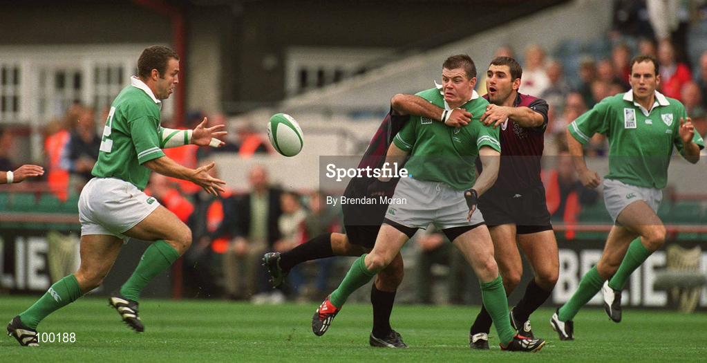 28 September 2002; Brian O'Driscoll of Ireland passes the ball to team-mate Kevin Maggs despite the tackle of Kakha Alania and Tedo Zibzibadze of Georgia during the Rugby World Cup 2003 Qualifier match between Ireland and Georgia at Lansdowne Road in Dublin. Photo by Brendan Moran/Sportsfile