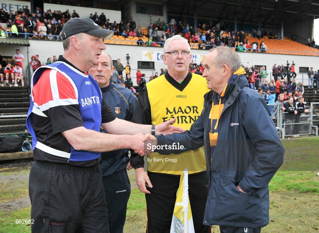 8 July 2012; Derry manager Ger Rogan, left, shake hands with Antrim manager Jim Nelson after the game the game. Ulster GAA Hurling Senior Championship Final, Antrim v Derry, Casement Park, Belfast, Co. Antrim. Picture credit: Barry Cregg / SPORTSFILE
