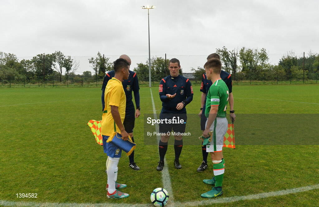 27 September 2017; Referee David Dunne performs the coin toss with team captains Cadu of Brazil and Séamas Keogh of Republic of Ireland during the International Friendly match between Republic of Ireland and Brazil at the AUL Complex in Dublin. Photo by Piaras Ó Mídheach/Sportsfile