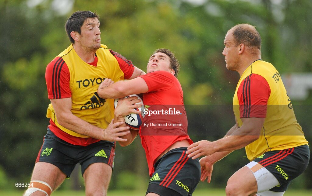 18 July 2012; Munster's Ian Keatley is tackled by James Downey, left, and BJ Botha, right, during squad training ahead of the 2012/13 season. Munster Rugby Squad Training, Cork Institute of Technology, Bishopstown, Cork. Picture credit: Diarmuid Greene / SPORTSFILE