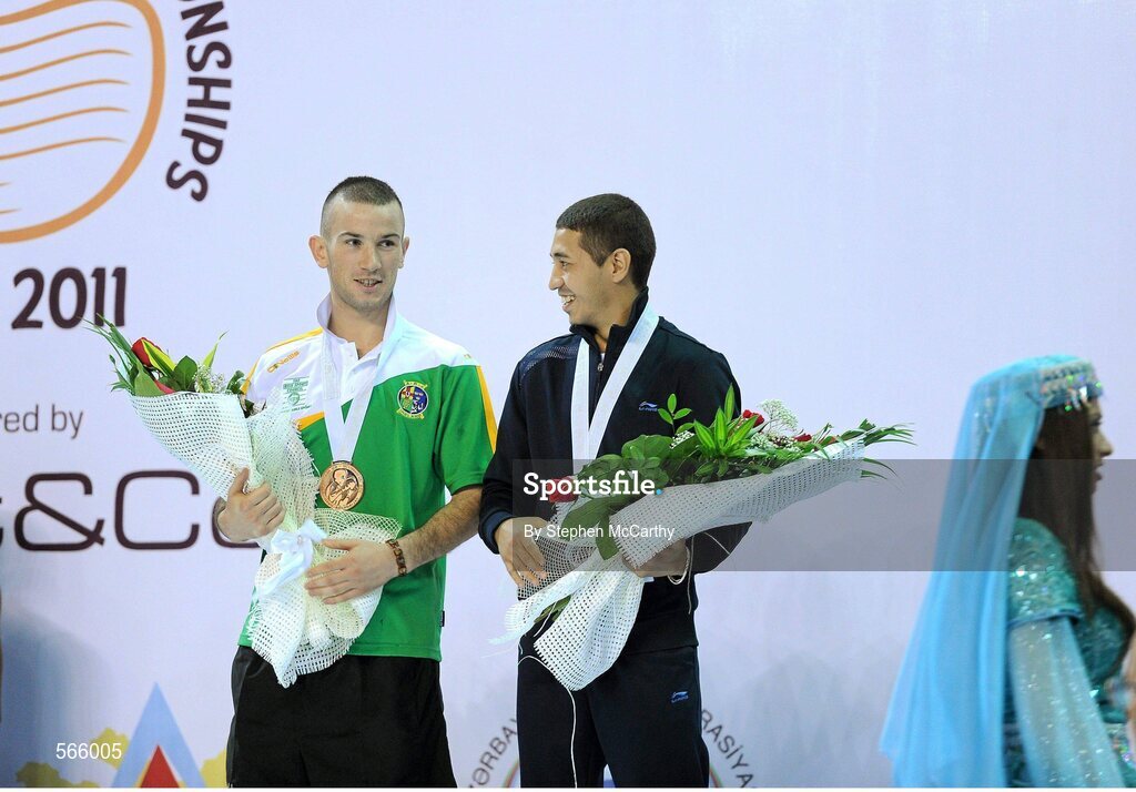 8 October 2011; John Joe Nevin, Cavan B.C., representing Ireland, after being presented with his 2011 AIBA World Boxing Championships 56kg bronze medal in conversation with fellow bronze medalist Anvar Yunusov, Tajikistan. 2011 AIBA World Boxing Championships. Heydar Aliyev Sports and Exhibition Complex, Baku, Azerbaijan. Picture credit: Stephen McCarthy / SPORTSFILE