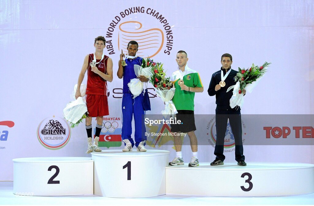 8 October 2011; John Joe Nevin, Cavan B.C., representing Ireland, after being presented with his 2011 AIBA World Boxing Championships 56kg bronze medal with fellow medalists, from left, Luke Campbell, England, siliver, Lazaro Alvarez Estrada, Cuba, gold, and Anvar Yunusov, Tajikistan, bronze, right. 2011 AIBA World Boxing Championships. Heydar Aliyev Sports and Exhibition Complex, Baku, Azerbaijan. Picture credit: Stephen McCarthy / SPORTSFILE