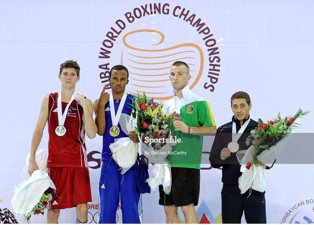 8 October 2011; John Joe Nevin, Cavan B.C., representing Ireland, after being presented with his 2011 AIBA World Boxing Championships 56kg bronze medal with fellow medalists, from left, Luke Campbell, England, siliver, Lazaro Alvarez Estrada, Cuba, gold, and Anvar Yunusov, Tajikistan, bronze, right. 2011 AIBA World Boxing Championships. Heydar Aliyev Sports and Exhibition Complex, Baku, Azerbaijan. Picture credit: Stephen McCarthy / SPORTSFILE