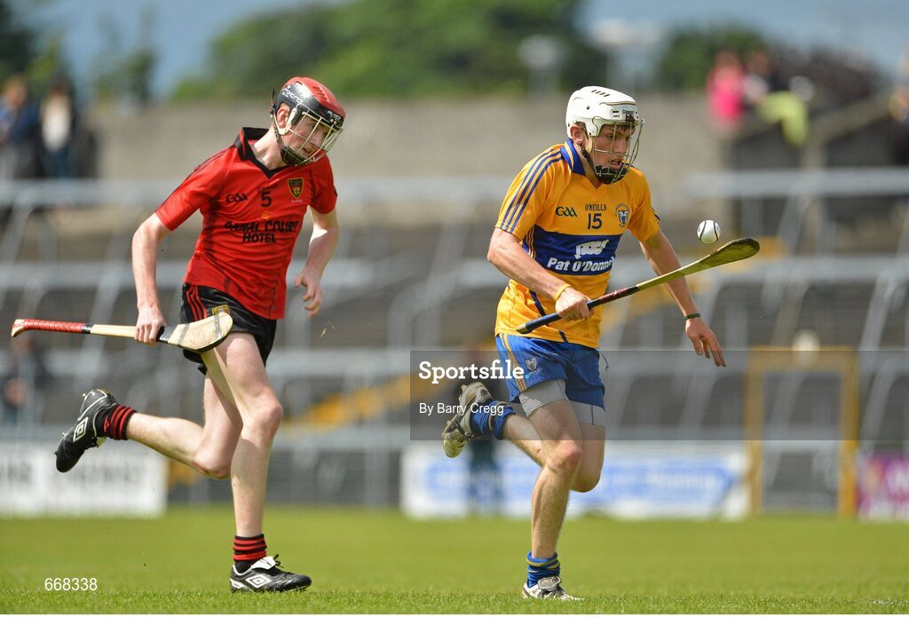 28 July 2012; Shane O'Donnell, Clare, breaks away from Ryan Brannigan, Down, on his way to scoring his side's second goal of the game. Electric Ireland GAA Hurling Minor Championship Quarter-Final, Down v Clare, Cusack Park, Mullingar, Co. Westmeath. Picture credit: Barry Cregg / SPORTSFILE
