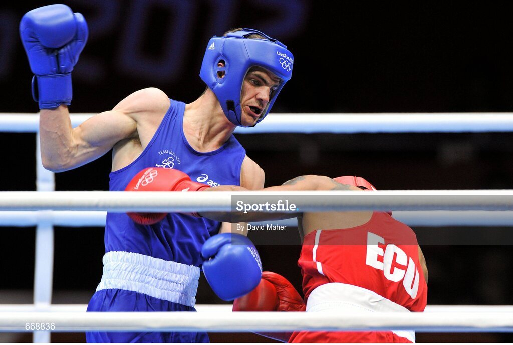 29 July 2012; Adam Nolan, Ireland, left, exchanges punches with Carlos Sanchez Estacio, Ecuador, during their men's welter 69kg round of 32 contest. London 2012 Olympic Games, Boxing, South Arena 2, ExCeL Arena, Royal Victoria Dock, London, England. Picture credit: David Maher / SPORTSFILE