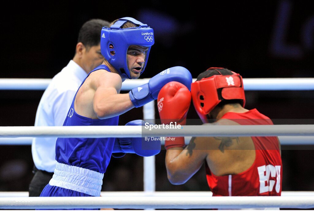 29 July 2012; Adam Nolan, Ireland, left, exchanges punches with Carlos Sanchez Estacio, Ecuador, during their men's welter 69kg round of 32 contest. London 2012 Olympic Games, Boxing, South Arena 2, ExCeL Arena, Royal Victoria Dock, London, England. Picture credit: David Maher / SPORTSFILE