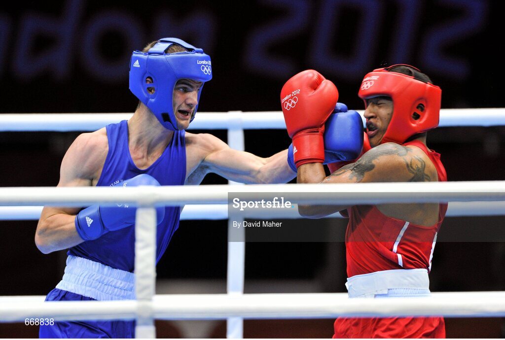 29 July 2012; Adam Nolan, Ireland, left, exchanges punches with Carlos Sanchez Estacio, Ecuador, during their men's welter 69kg round of 32 contest. London 2012 Olympic Games, Boxing, South Arena 2, ExCeL Arena, Royal Victoria Dock, London, England. Picture credit: David Maher / SPORTSFILE